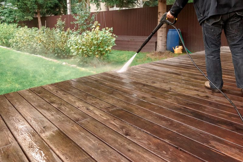 Power washing a wooden deck